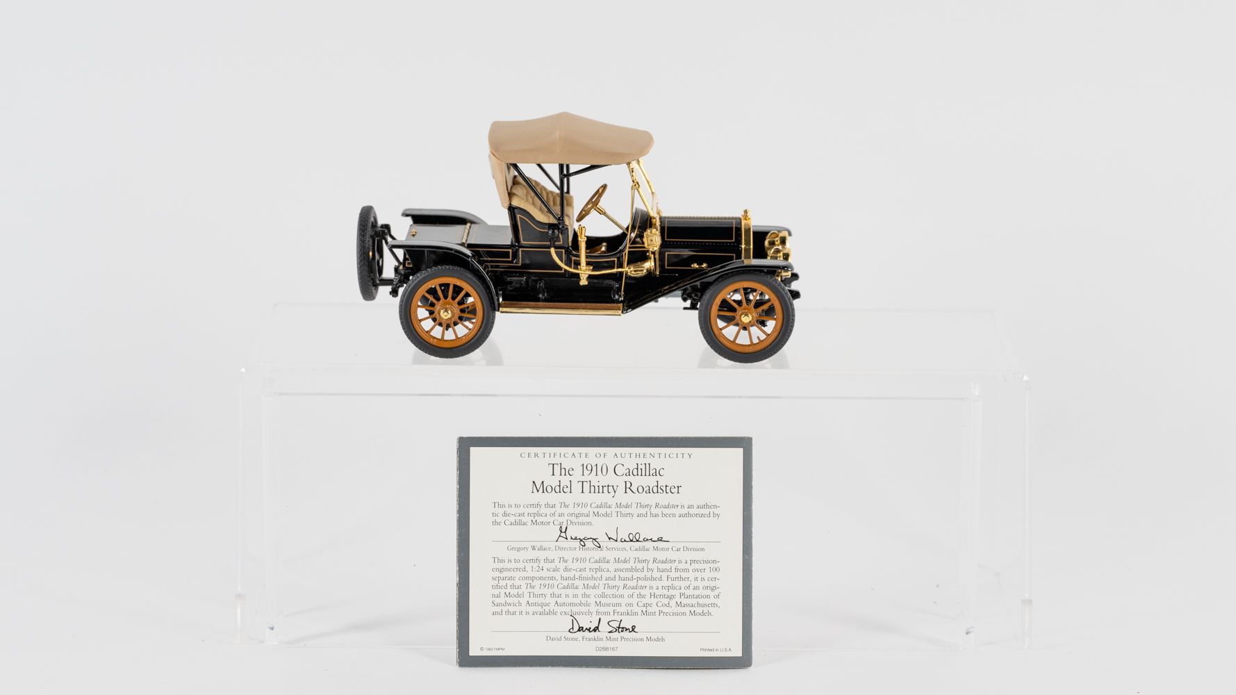 Three Franklin Mint Precision Model cars, comprising a 1910 Cadillac Roadster, 1912 Packard Victoria and a